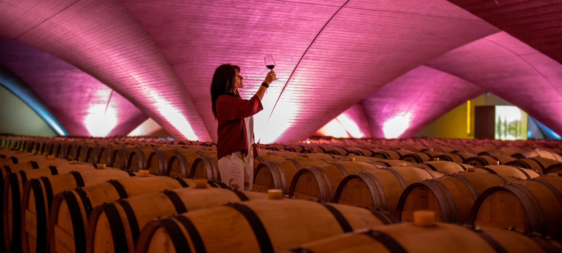 Woman with a glass of wine in her hand Woman with a glass of wine in her hand