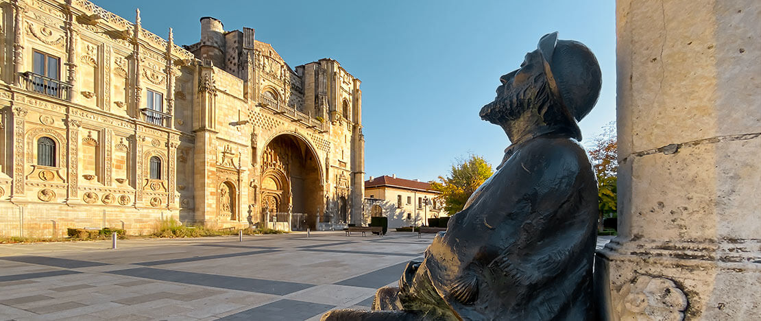 Statue of a pilgrim in front of the Parador Hotel and San Marcos Church in Castile and Leon Statue of a pilgrim in front of the Parador Hotel and San Marcos Church in Castile and Leon