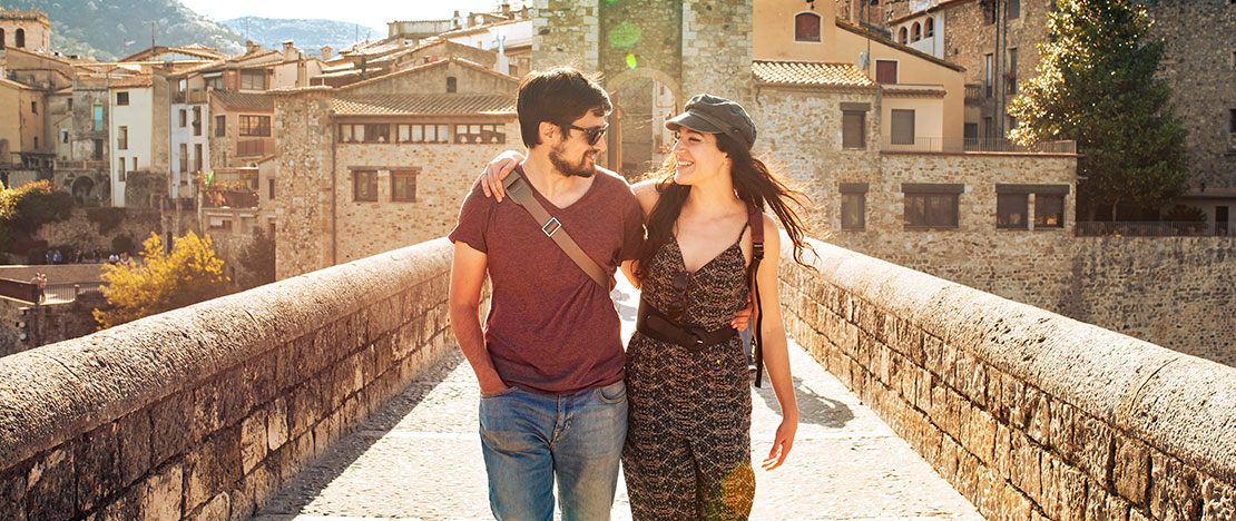 Couple on Roman bridge in Besalú Couple on Roman bridge in Besalú