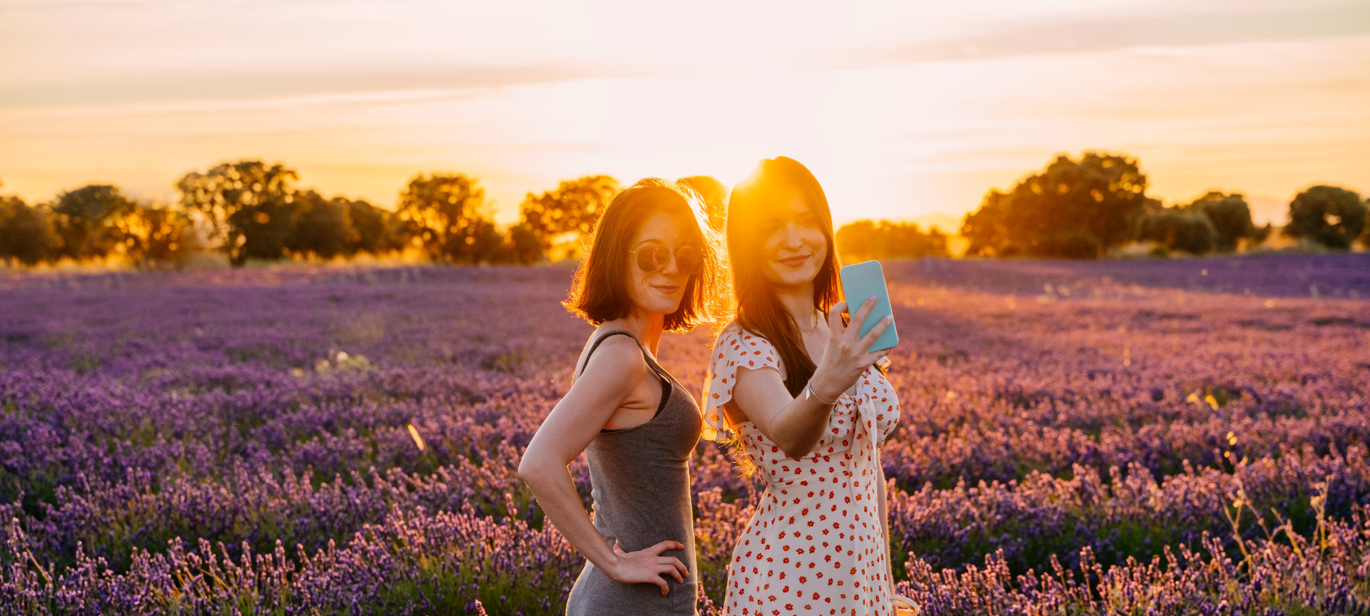 Couple posing in a lavender field during sunset Couple posing in a lavender field during sunset