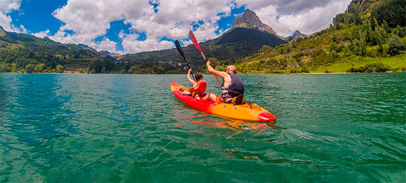 Tourist on a kayak trip in the Pyrenees Tourist on a kayak trip in the Pyrenees